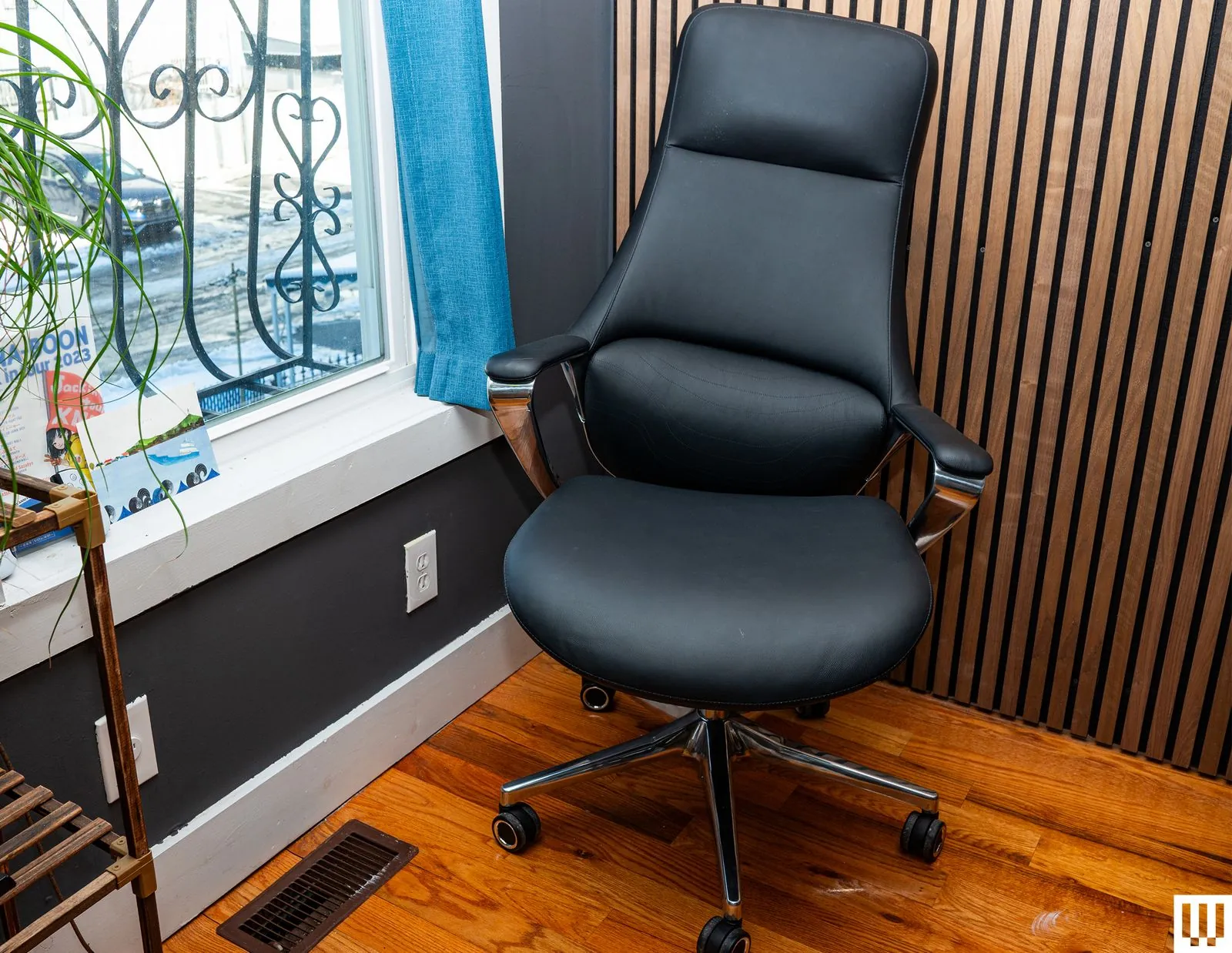 Adjusting the height of an ergonomic office chair for proper desk alignment.