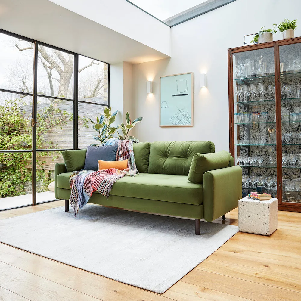 A clean and minimalist living room setting perfect for discussing sofa buying questions.