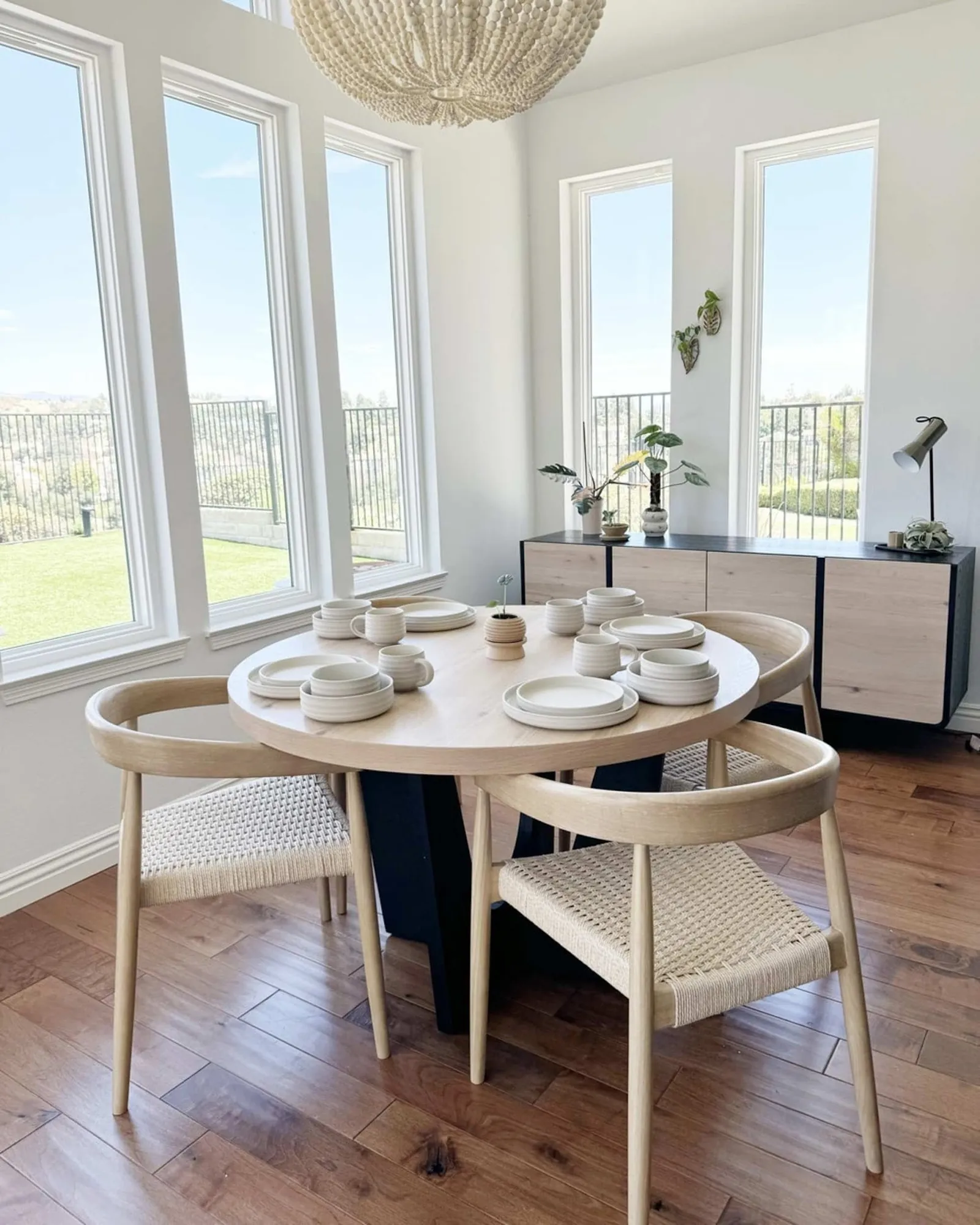 A peaceful dining room scene used to illustrate common questions about wood table care.