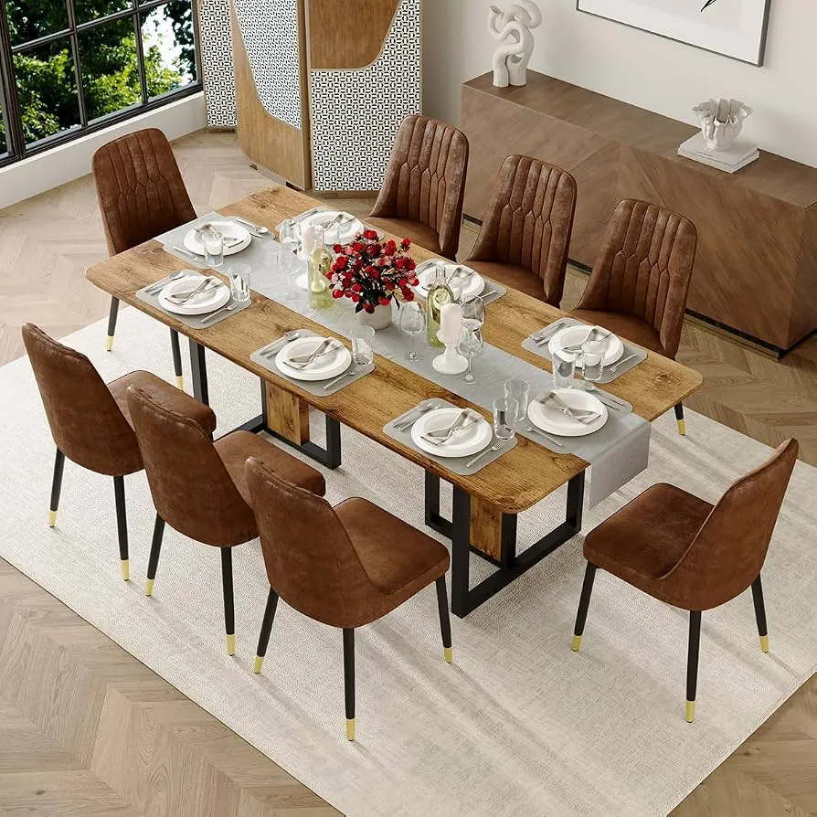A person checking the symmetry and spacing of a dining table setting.