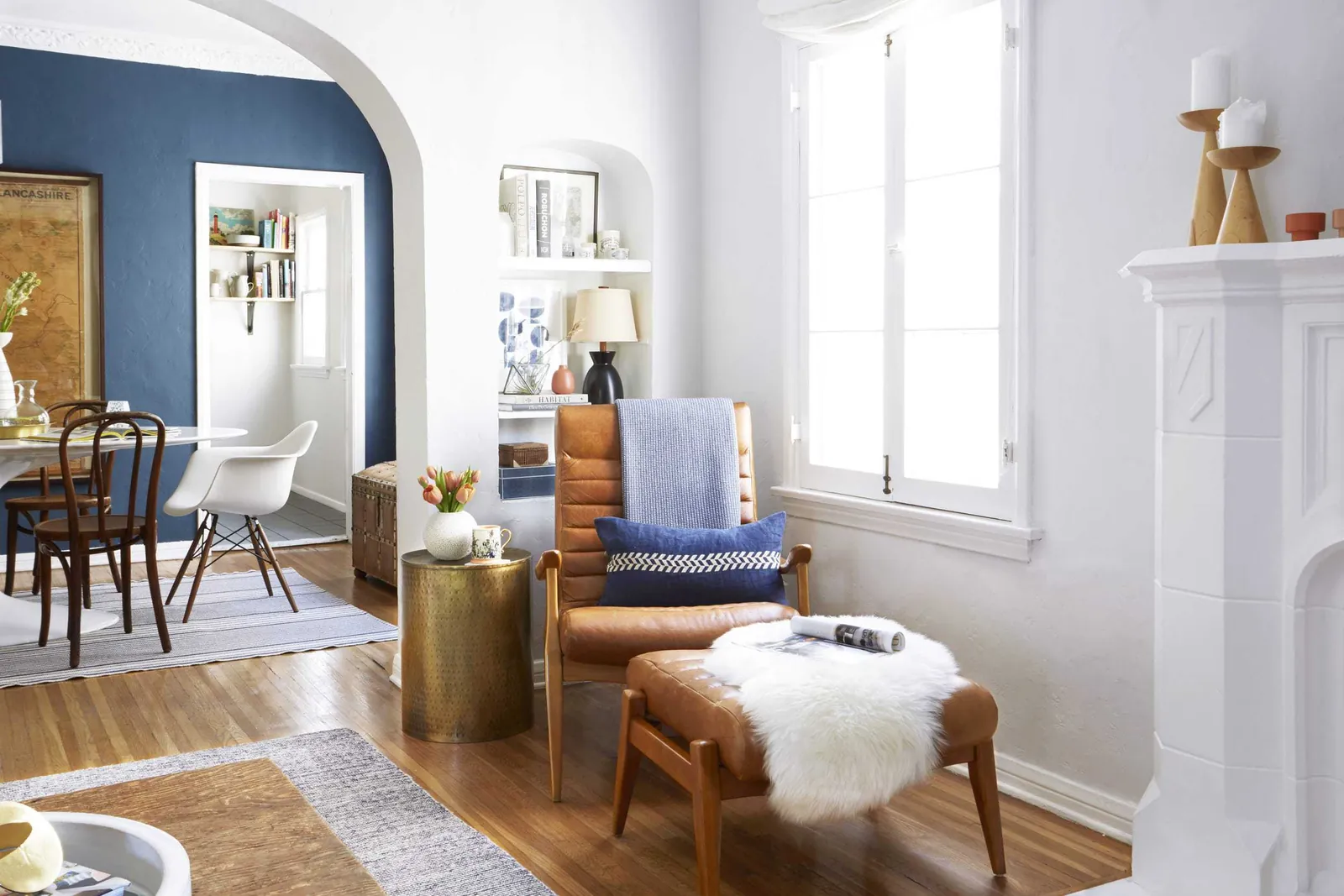 A person sits comfortably in a well-styled accent chair that maintains its functionality.