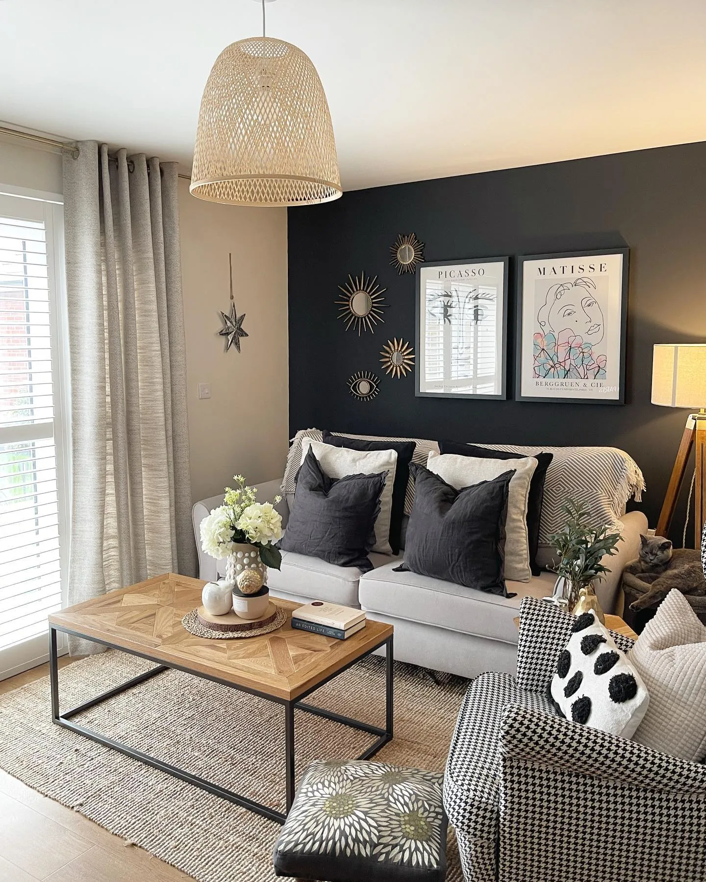 An area rug connecting a sofa and chairs to resolve design inconsistencies.