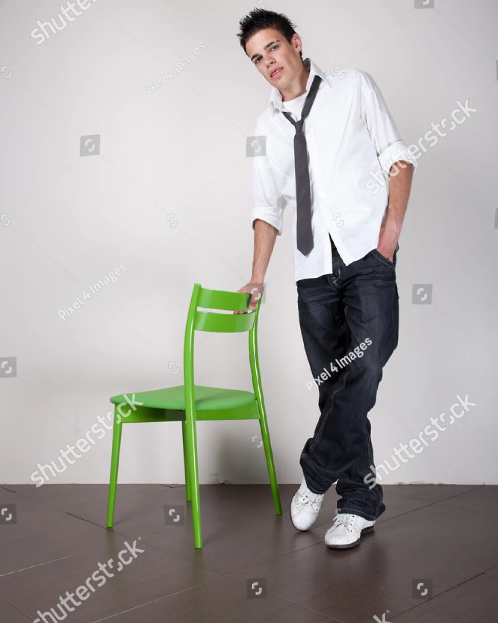 Close-up of elegant hand placement on a chair to improve posing technique.