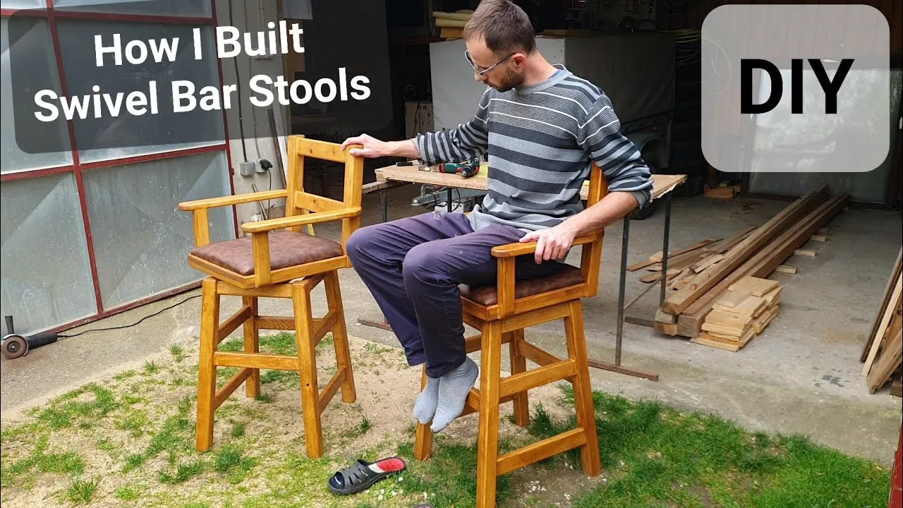 Essential hardware for a swivel chair laid out on a clean workbench.