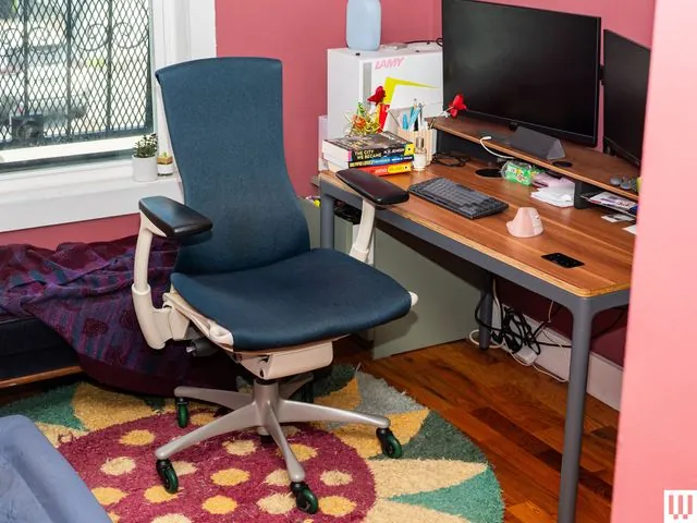 Measuring body dimensions with a tape measure to select the right ergonomic office chair.