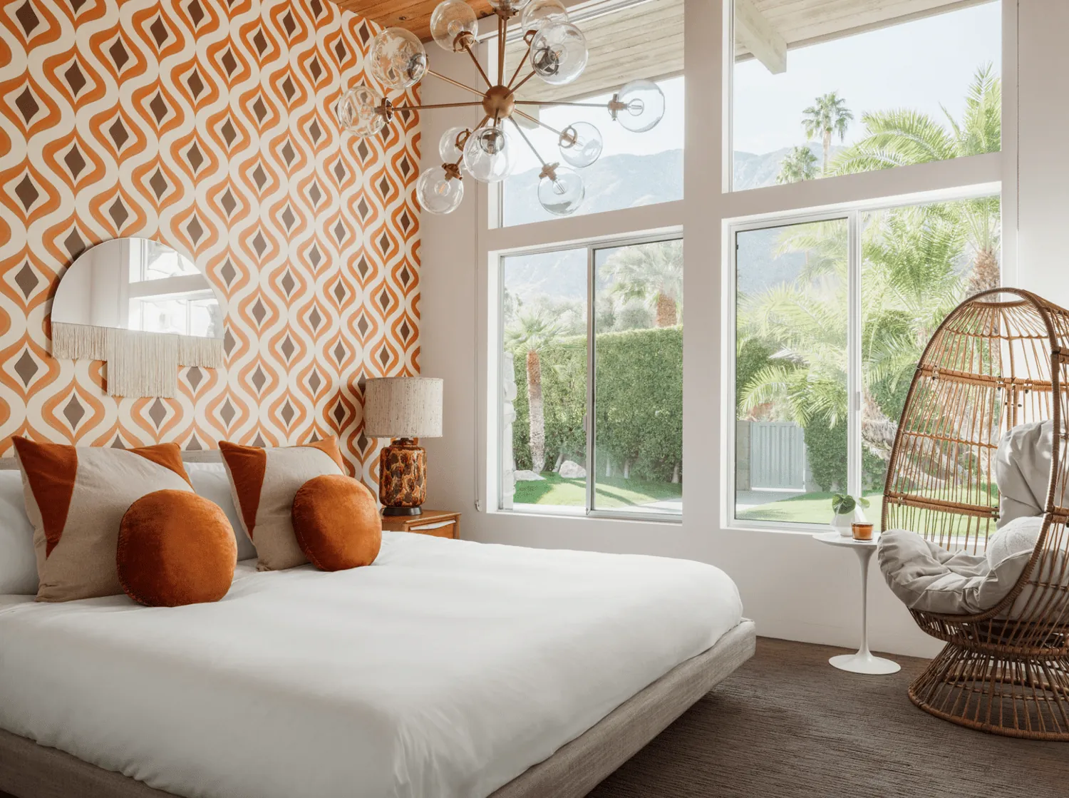 A polished bedroom seating area featuring elegant furniture and carefully curated home decor.