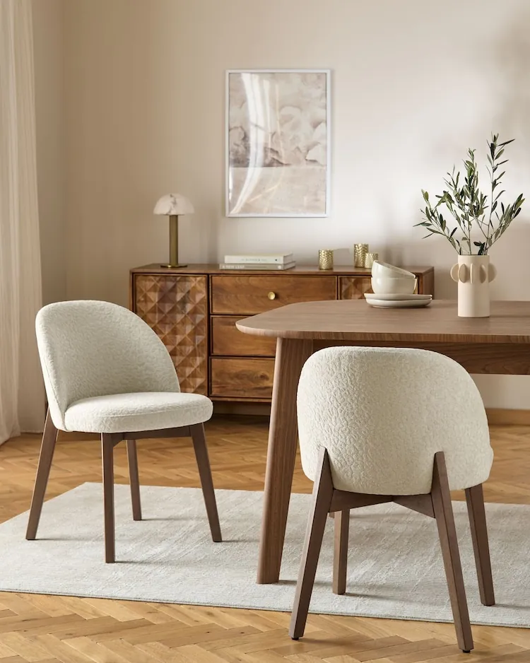 Sturdy wooden dining chairs placed in a comfortable and practical home.