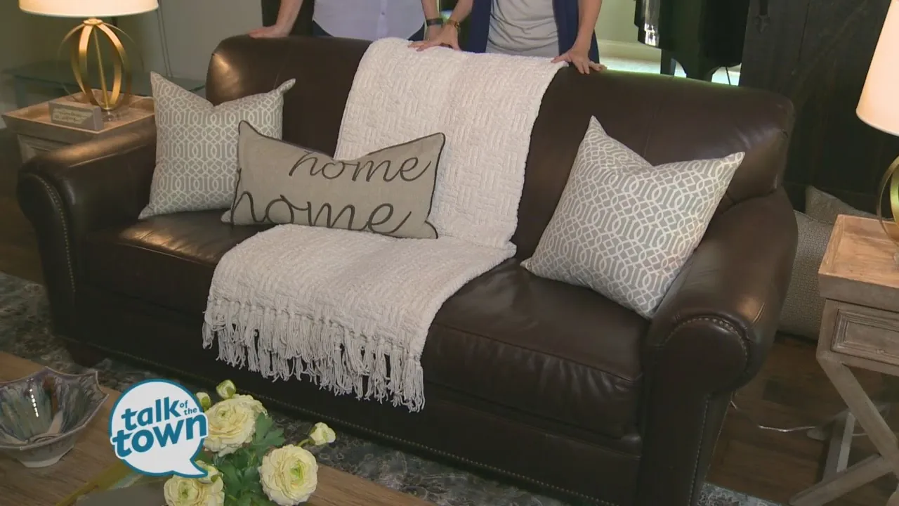 A well-styled brown sofa that looks bright and integrated into the living room space.